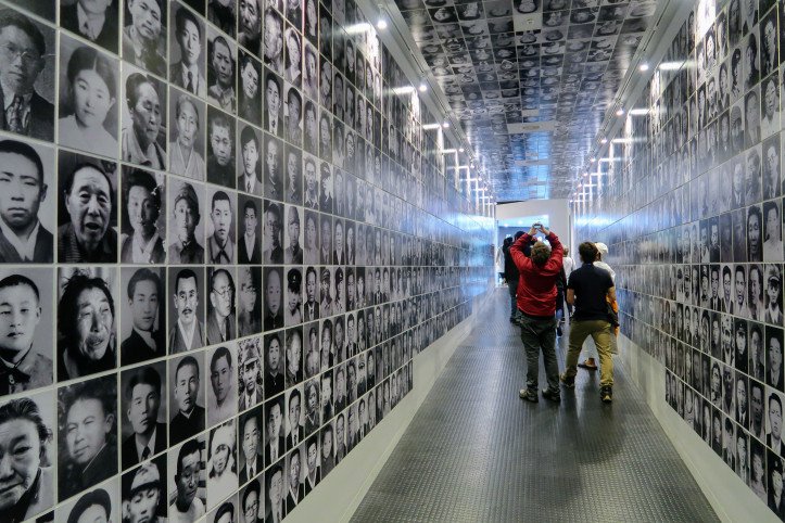 Images of the victims line a corridor of the exhibition hall.